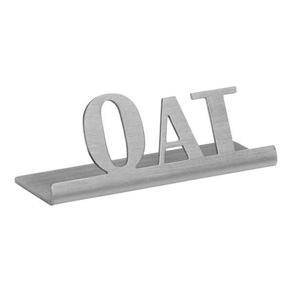A brushed stainless steel table sign with the word "oat" on it.