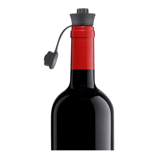 A wine bottle fitted with a Coravin Pivot wine stopper.