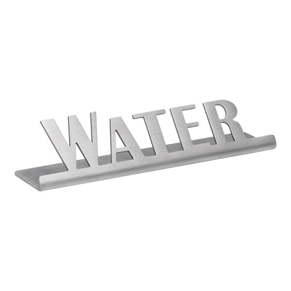 A brushed stainless steel tabletop sign that says "Water" in silver metal letters.