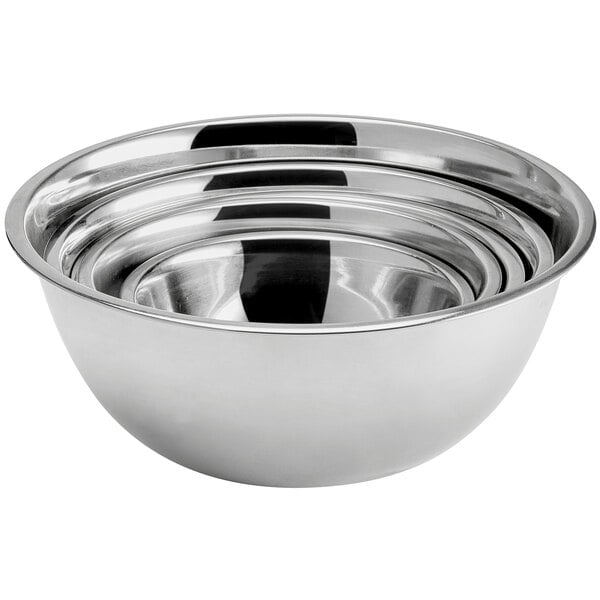 A set of stainless steel mixing bowls nested together.