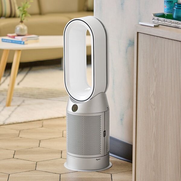 A white and silver Dyson Purifier Hot+Cool on a floor.