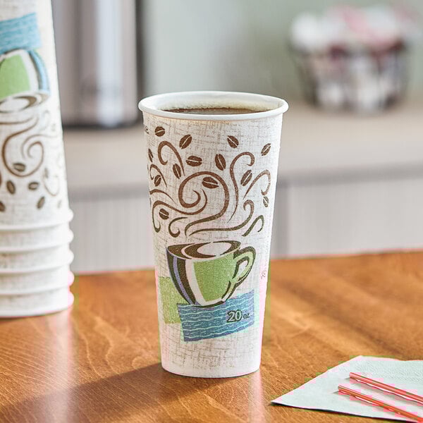 A Dixie PerfecTouch paper hot cup with a straw in it on a counter.