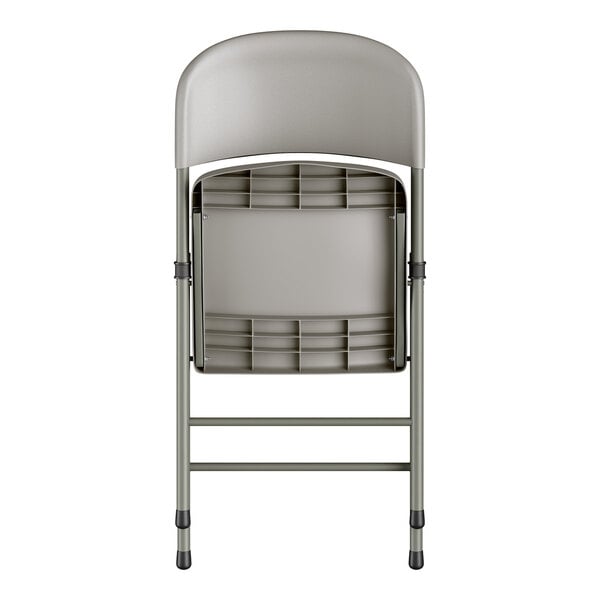 A gray contoured injection-molded folding chair with a charcoal frame and gray legs, shown in a folded position.