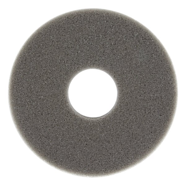 A grey sponge with a hole in the middle.
