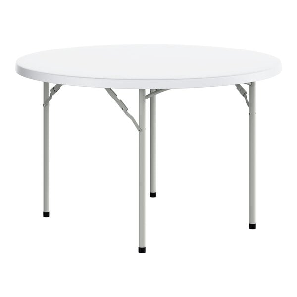 A round, white plastic folding table with gray metal legs.