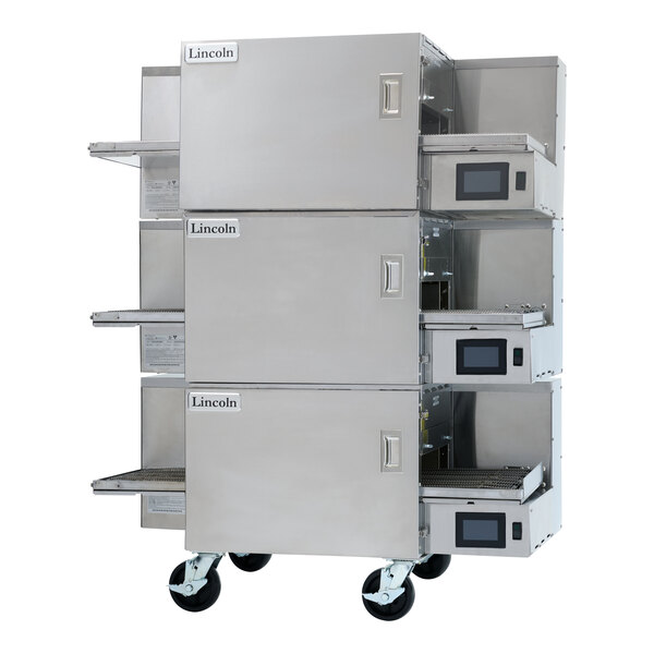 A triple stacked stainless steel electric conveyor oven with three 20 3/4-inch wide belts and digital controls, mounted on casters.