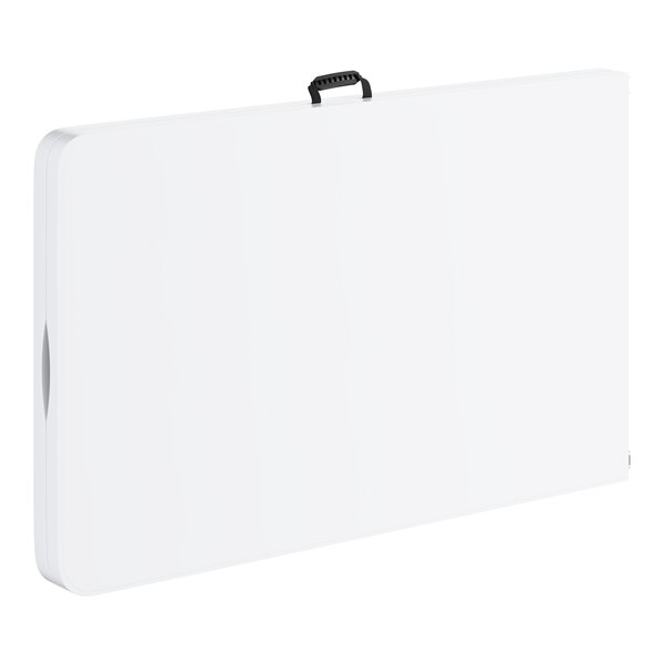 A large rectangular white plastic bi-folding table with a black carrying handle and gray legs.
