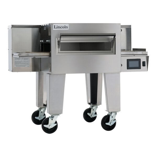 A stainless steel Lincoln Aperion conveyor oven with a wide belt and caster wheels.