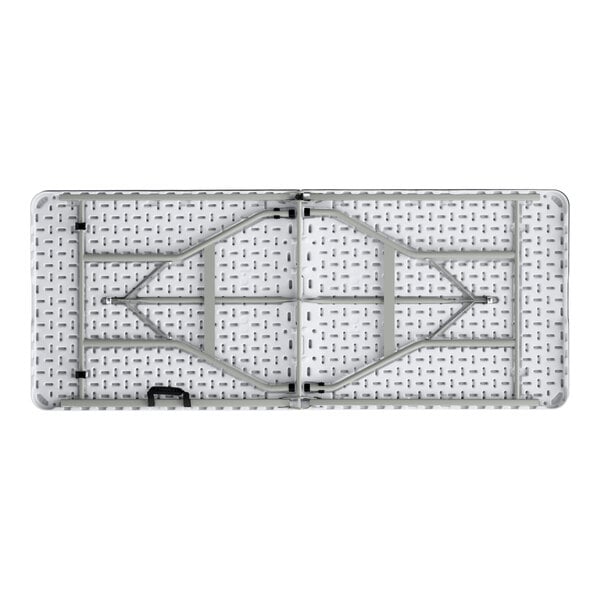 A rectangular granite white plastic bi-folding table with gray metal legs.