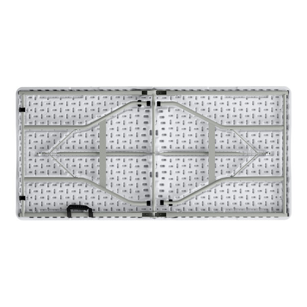 A rectangular granite white plastic bi-folding table with gray legs and a carrying handle.