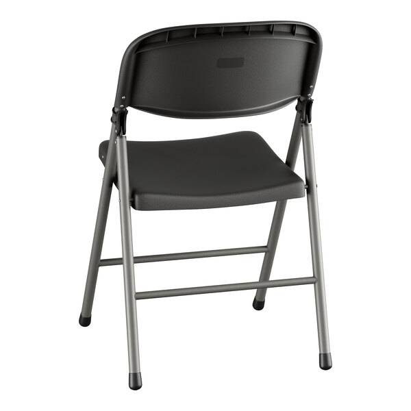 A Lancaster Table & Seating black folding chair with a charcoal seat and legs.