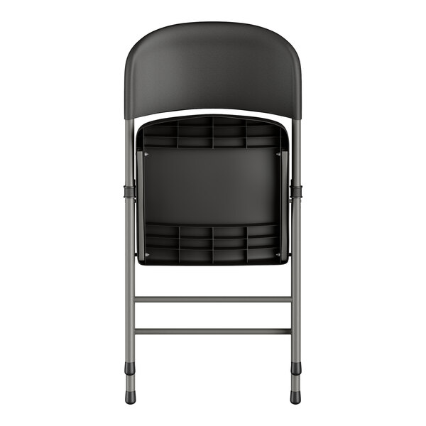 A Lancaster Table & Seating black folding chair with a metal frame.