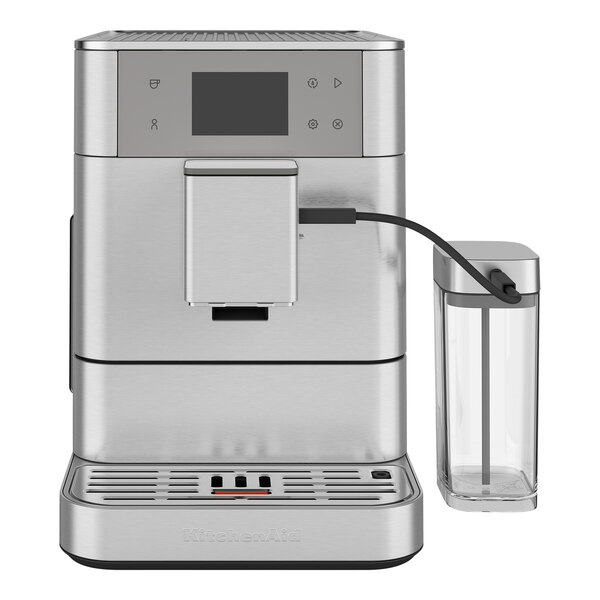 A close-up of a silver Kitchen Aid espresso machine with a black handle.