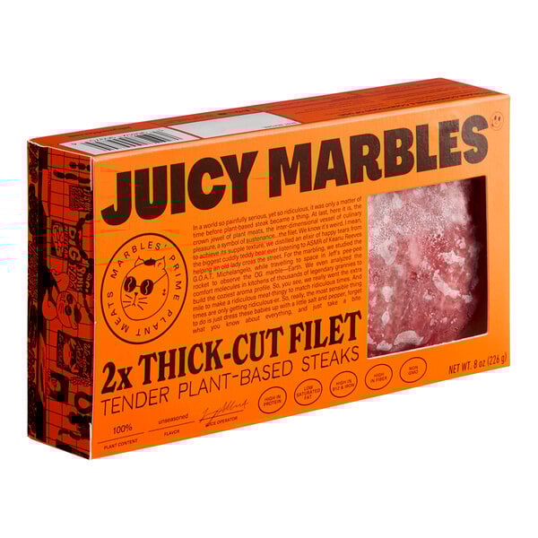 A package of Juicy Marbles plant-based filet meat in an orange box.