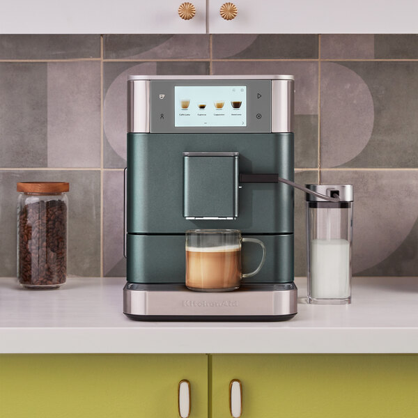A KitchenAid espresso machine on a counter.