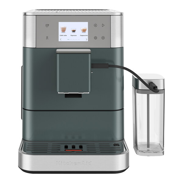 A close-up of a Kitchen Aid espresso machine with a glass container.