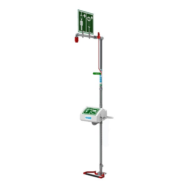 A Hughes floor-mount eye wash and safety shower station with a green sign.