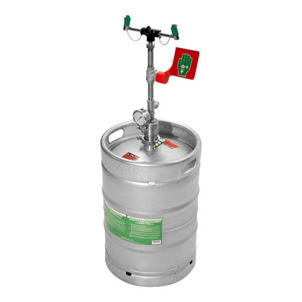 A Hughes stainless steel self-contained eye wash keg with a handle and green flag.