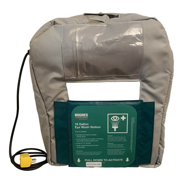 A grey bag with a green and white sign reading "Hughes 16GFEW-BLKT-HT"