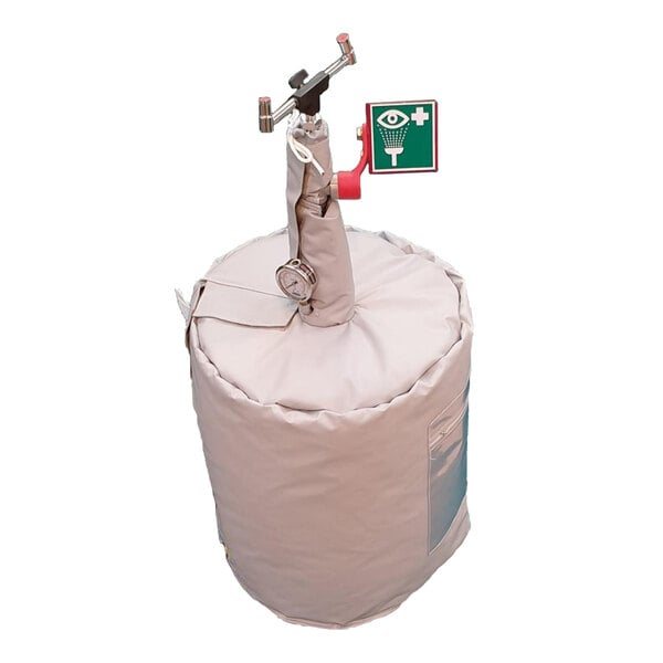 A white bag with a red handle and a sign that says "Hughes" containing a large black cylinder.