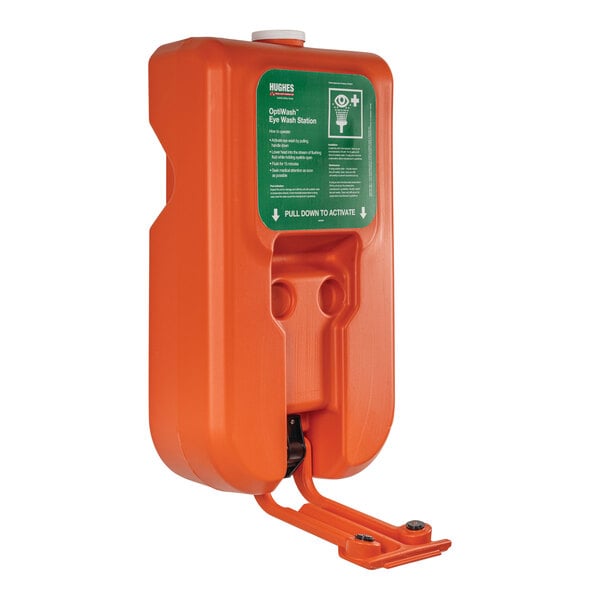 An orange Hughes eye wash station with a green handle.