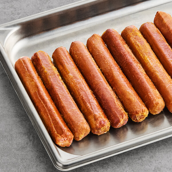 A tray of Beleaf plant-based vegan hot dogs on a gray surface.