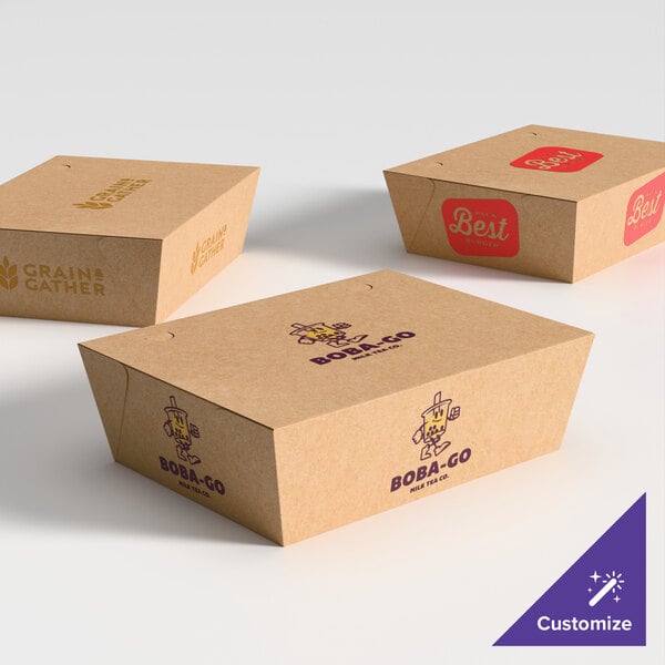 A group of Southern Champion ChampPak paper take-out boxes with different designs.