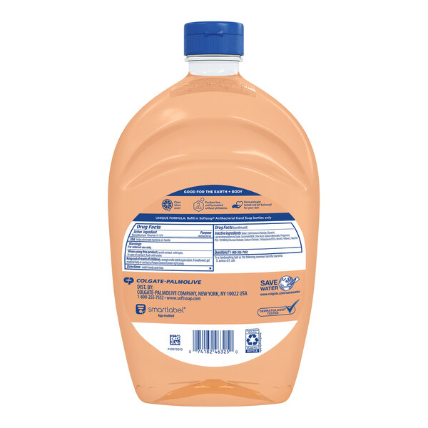 A plastic container of Softsoap Crisp Clean Scent liquid hand soap with a blue cap and label.