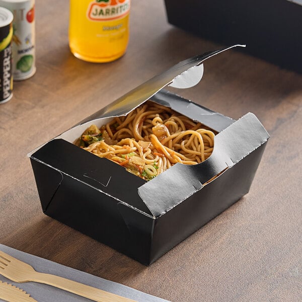 A black Southern Champion folded paper take-out box filled with noodles and vegetables.