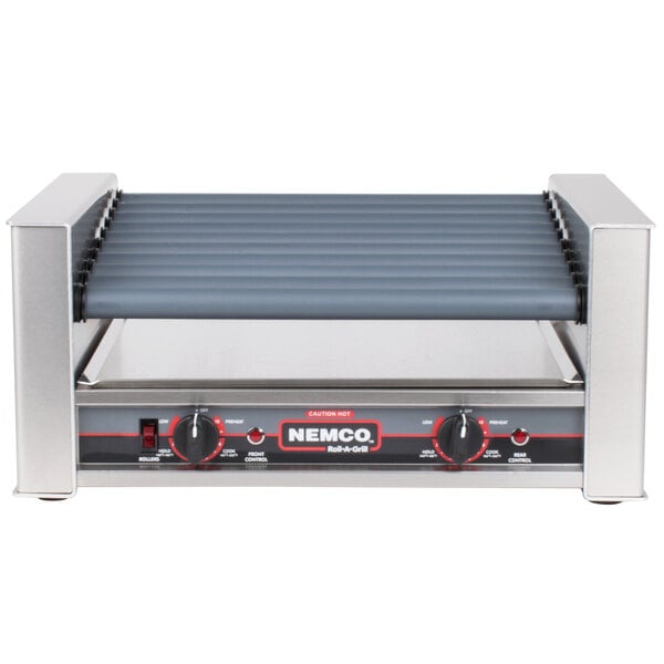 A Nemco slanted hot dog roller grill with black and silver plates on top.