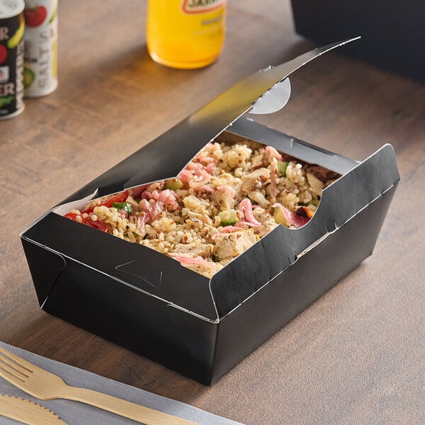 A black box of food from Southern Champion on a table.