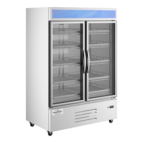 A commercial white swing glass door merchandiser refrigerator with two doors and multiple shelves.