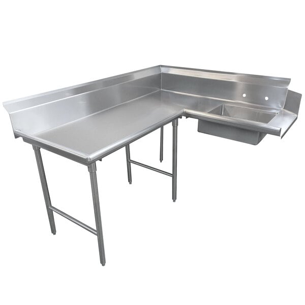 A stainless steel L-shaped dishtable with a drain on the left.