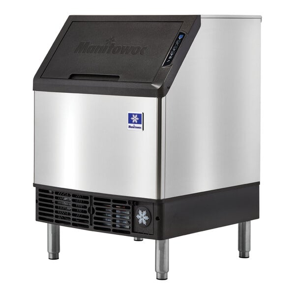 A silver and black Manitowoc undercounter ice cube maker.