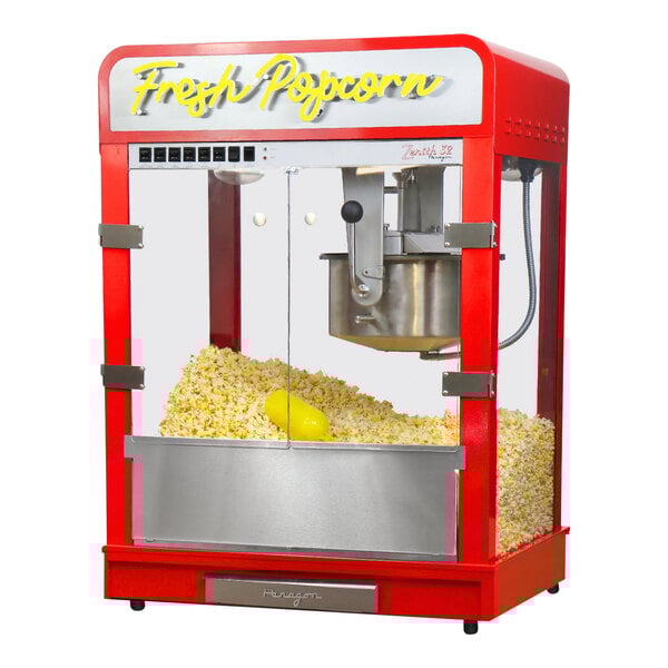 A red and silver Paragon Zenith countertop popcorn machine with "Fresh Popcorn" neon sign.