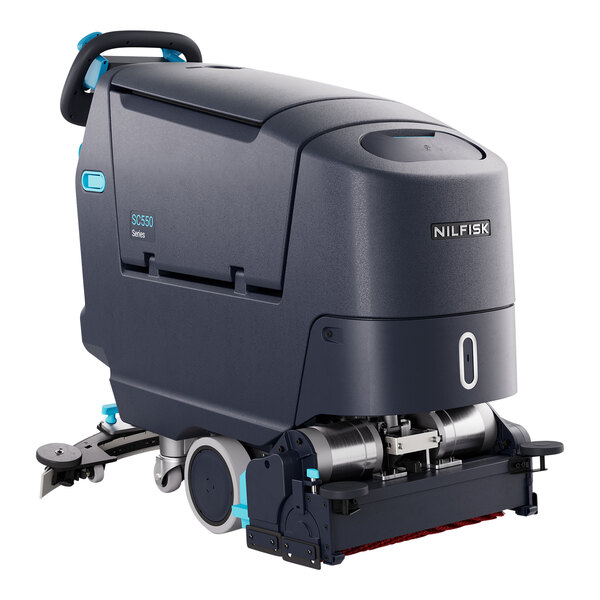 A Nilfisk SC550 cylindrical floor scrubber with wheels on it.