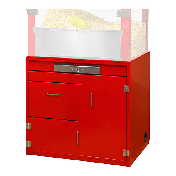 A red Paragon popcorn stand cabinet with drawers.