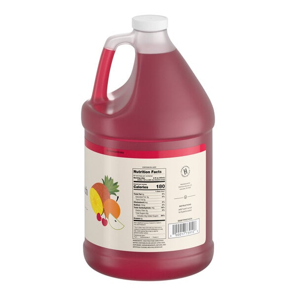 A large, translucent plastic jug with a white cap, filled with red liquid and featuring a label with fruit illustrations and nutrition facts.