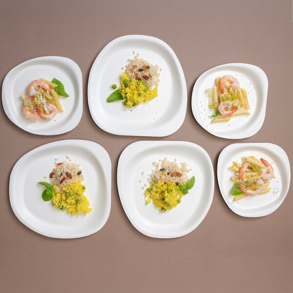 A white Jungle Stone compostable sugarcane pulp bowl filled with food.