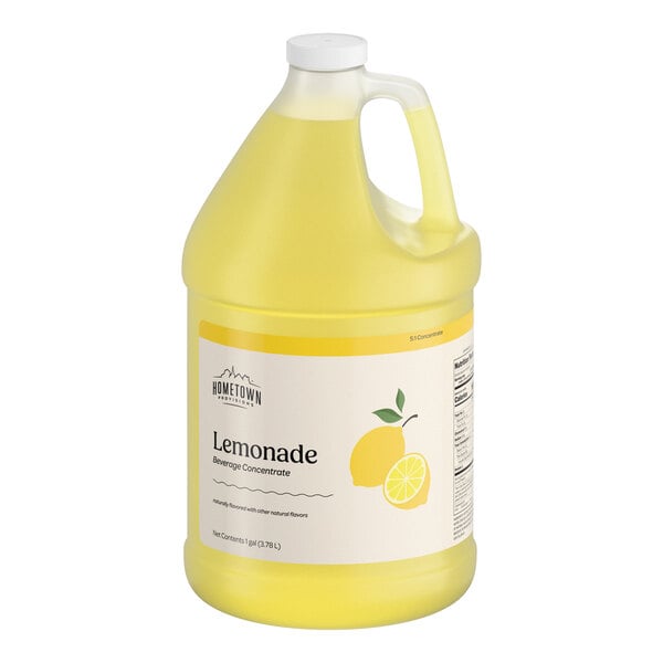 A large, translucent yellow plastic jug with a handle and a white cap, labeled as lemonade beverage concentrate with an image of a lemon on the front.