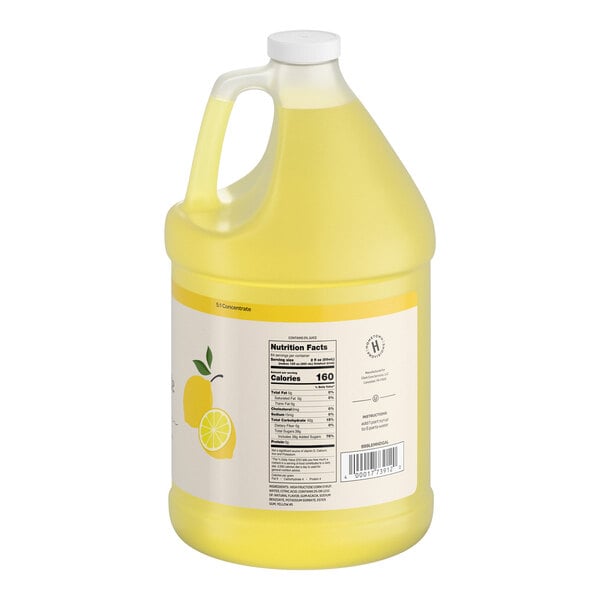 A large, translucent yellow plastic jug with a handle and a white cap, featuring a label with a lemon illustration and nutrition facts.