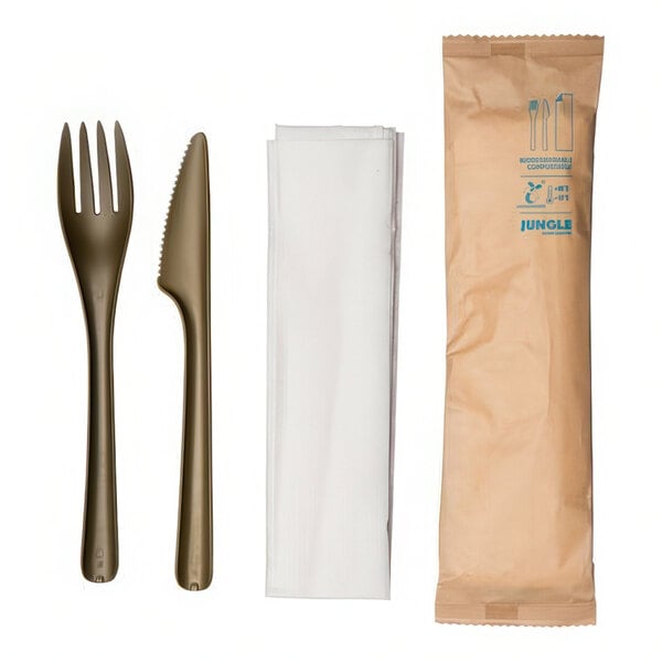 A Jungle Bloom compostable plastic fork and knife set in a paper bag.