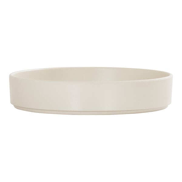 An ivory-colored melamine plate with a raised rim.