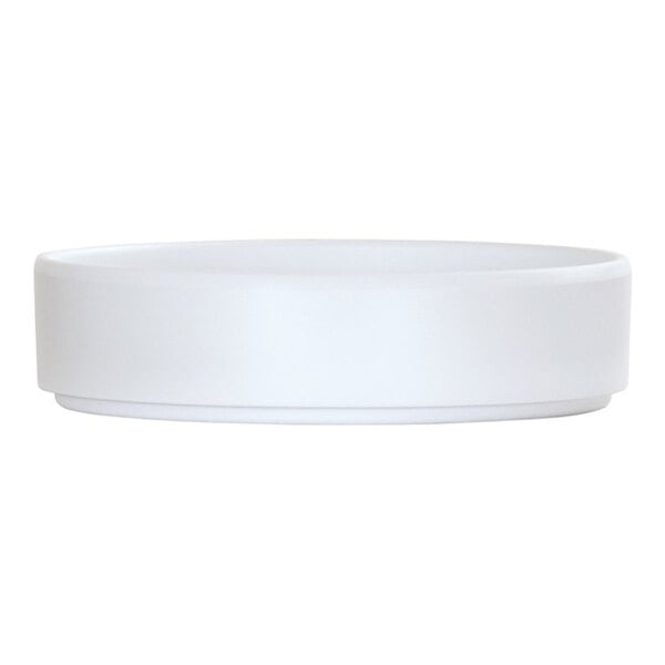A white, round melamine plate with a raised rim.