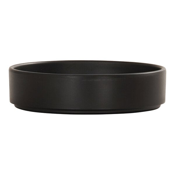 A black melamine plate with a raised rim.