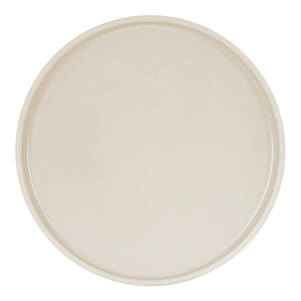 An ivory-colored, round melamine plate with a low rim.