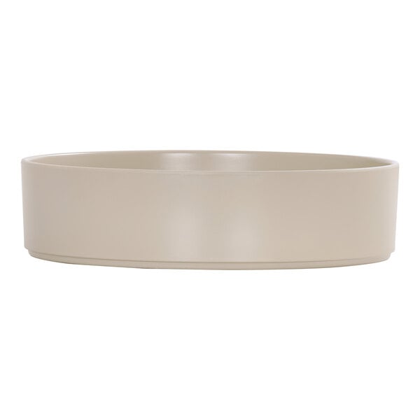 A taupe raised rim melamine bowl with a 72 oz. capacity.