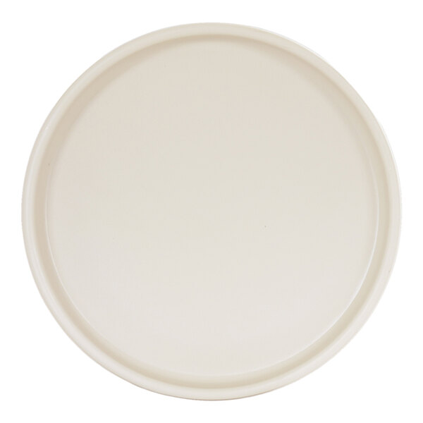 A round ivory melamine plate with a low rim.