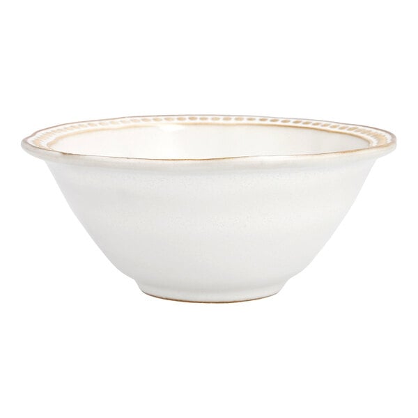 A white Mannette Perls stoneware bowl with an embossed pearl edge.