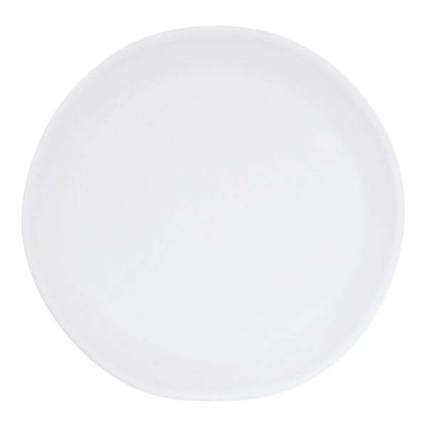 A white, irregular round melamine plate.
